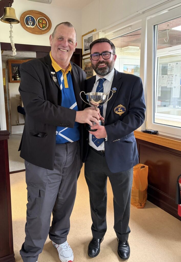 Hyndland President Graham Hogg (right) presents Stewarton President David Hutchison with the annual trophy.